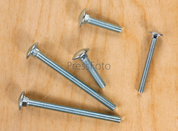 screws on a wooden board