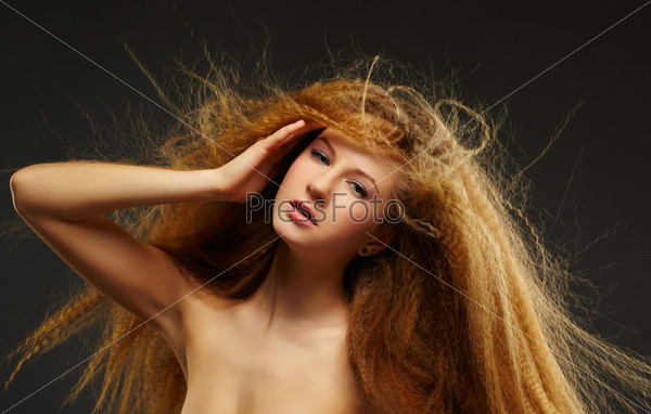 long-haired curly redhead woman