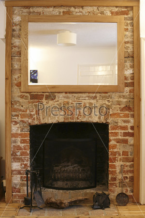 old brick fireplace in renovated house in england