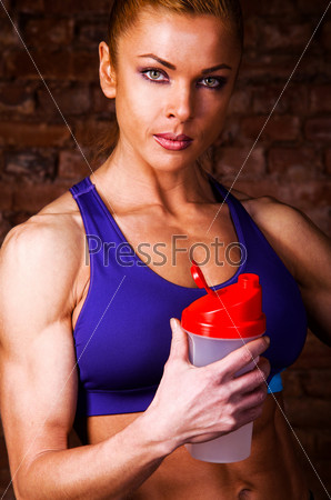strong woman with sports nutrition