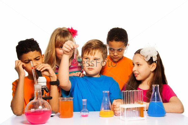 Team of five kids experimenting on chemistry lesson with test tubes, liquids and flasks, isolated on white