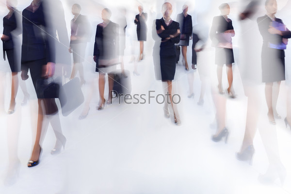 A number of business people walking - blurred motion