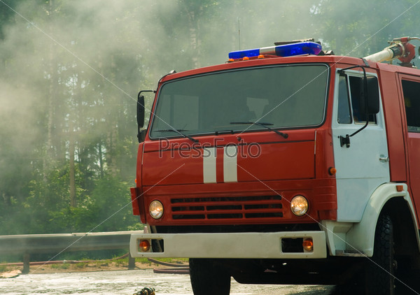 fire engine on the fire with smoke on background