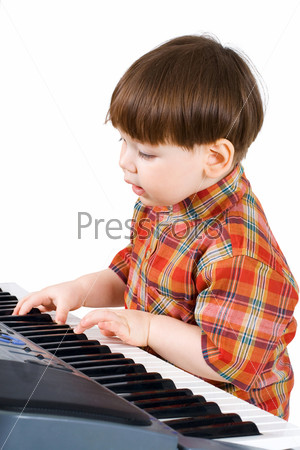 young toddler stu to play music on piano
