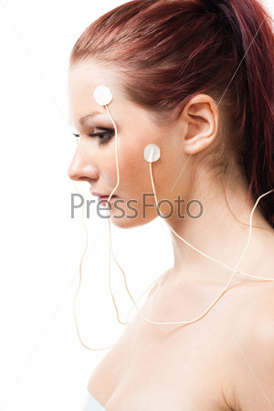 woman with brain sensors on her face, in profile,\
isolated