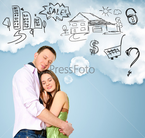 Smiling beautiful couple standing and embracing. Woman dreaming about their future