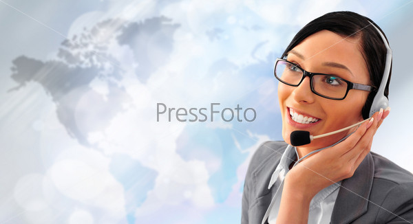 Telemarketing headset woman from call center smiling happy talking in hands free headset device. Business woman in suit in front of world map background.