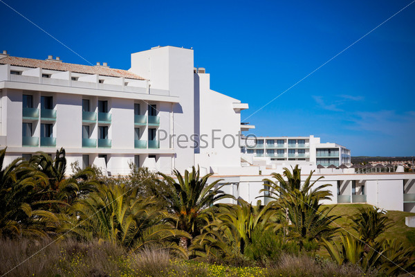 New Resort Apartment House against bright blue sky. Horizontal shot
