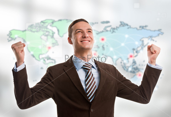 Portrait of young man standing in front of big world map. Server locations and actual online connections are displayed on virtual map. Hosting provider concept.