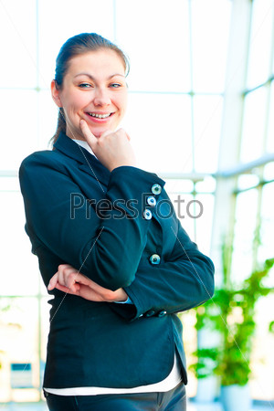 Portrait of smiling successful business people on the background of a blurred office interior