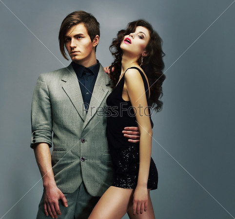 Lifestyle.Young Well-Dressed Couple in Elegant Fashion Clothes Hugging