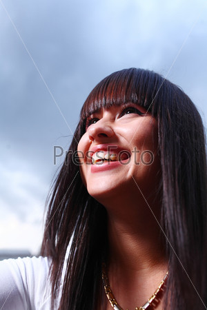 face outdoor portrait of young beautiful tender girl lightened with sun backlit blank expression