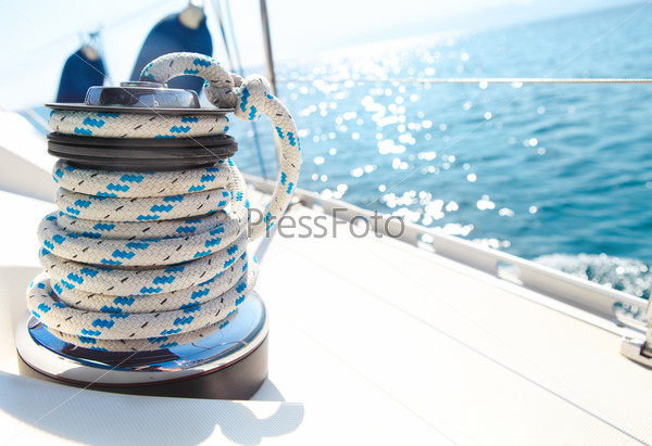 Sailboat winch and rope yacht detail. Yachting
