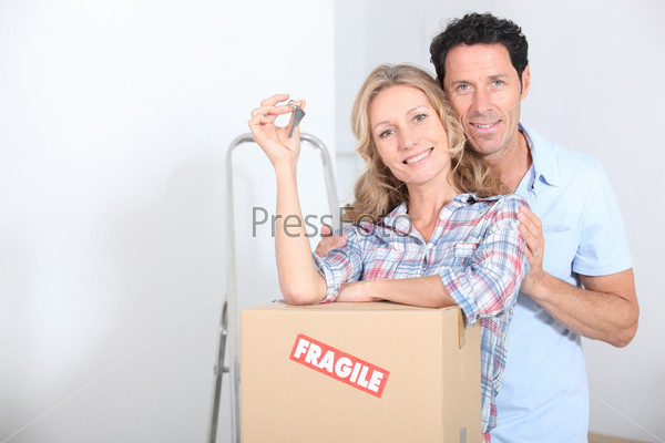 Couple with the keys of new flat