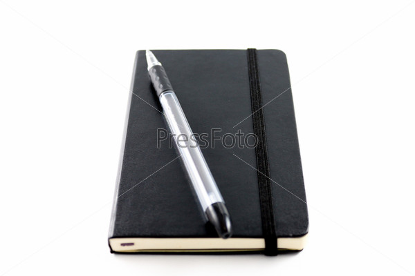 Black Notebook with pen isolated white background.
