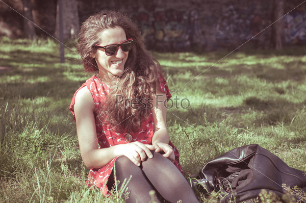 Eastern hipster vintage woman with shades at the park, stock photo