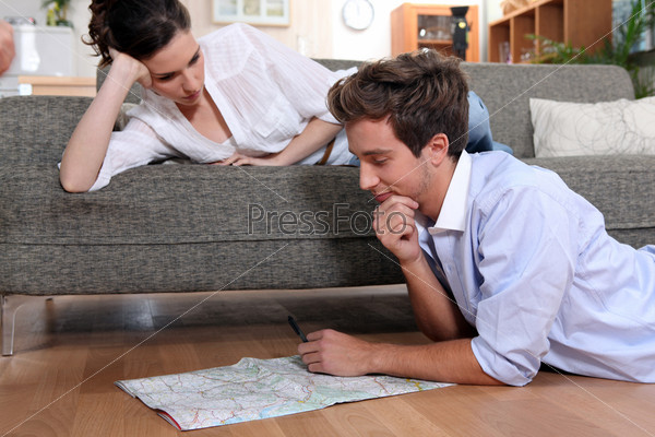 Couple plotting route on map