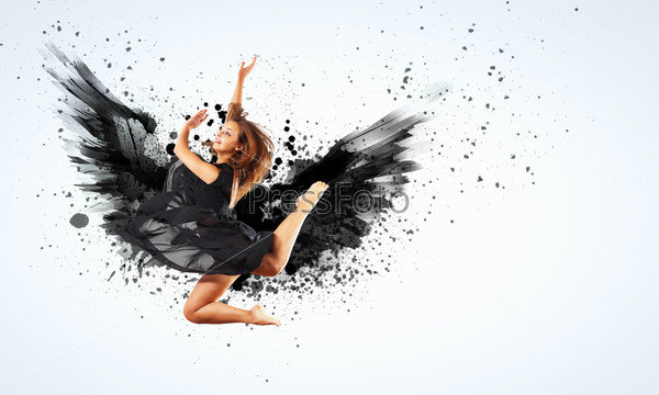 Woman floating in a dance on dark wings. Collage, stock photo