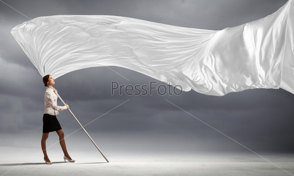 Image of attractive businesswoman holding white flag. Place for text