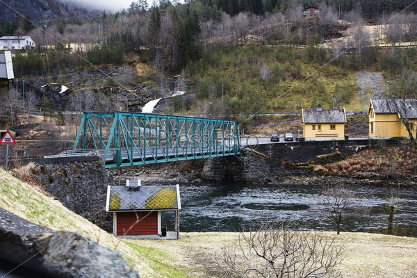 Truss bridge with a ride on the bottom of a Norwegian fjord