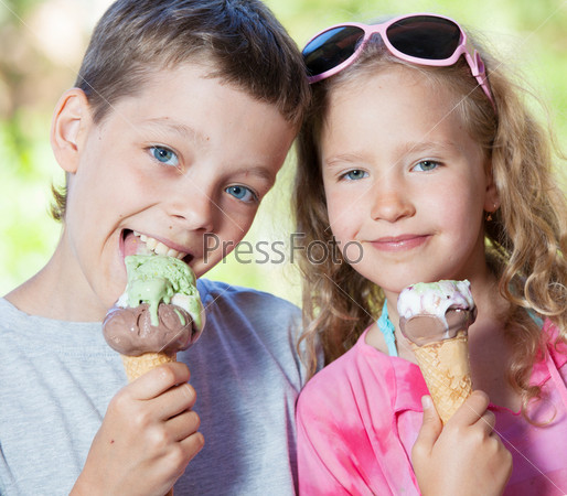 Happy children with ice cream outdoors