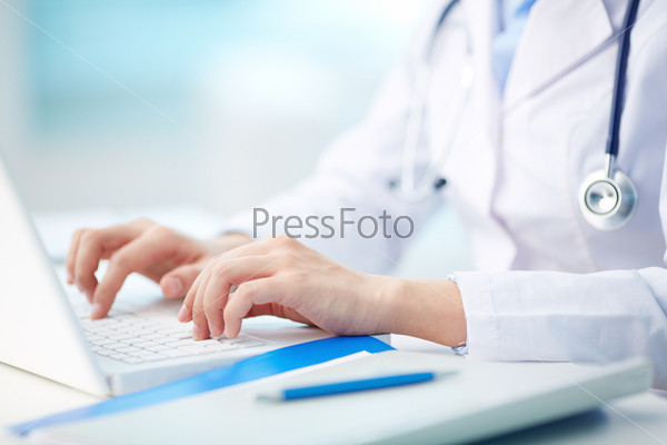Medical person typing