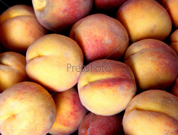 The texture of the delicious red yellow peaches