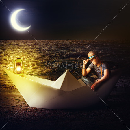 Man traveler sitting in fantasy paper boat