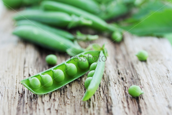 Young Fresh Juicy Pods Of Green Peas