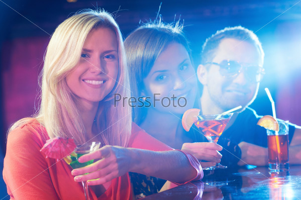 Portrait of happy friends having party in bar