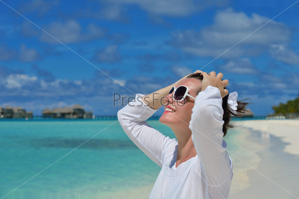 happy young woman on summer vacation on beautiful tropical beach have fun and relax