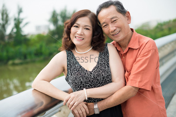 Portrait of a senior husband embracing his wife