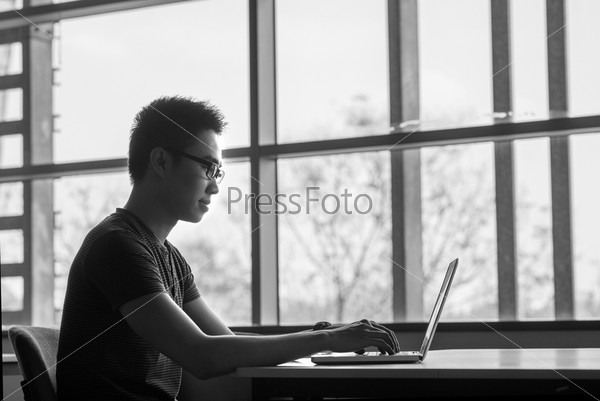 Black-and-white portrait of a young programmer