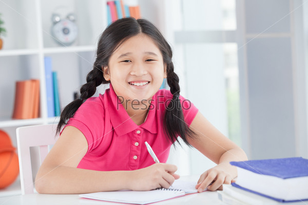 Portrait of a schoolgirl laughing inside