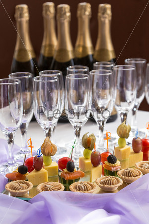 catering serving buffet with canapes and champagne