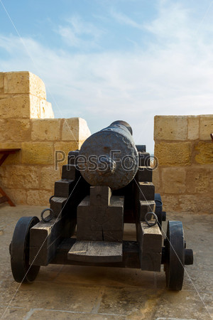 Gozo, Rabat, cannon in castle with cloudy sky