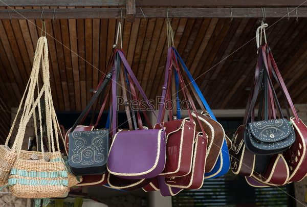 Handbags display on open street market shop