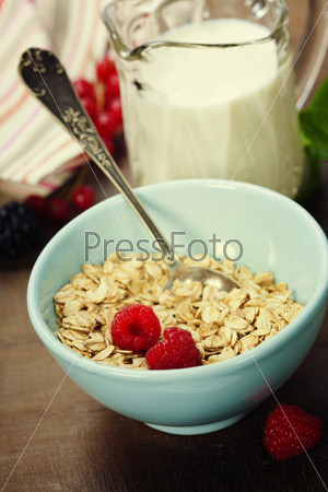 healthy breakfast with bowl of oat flakes