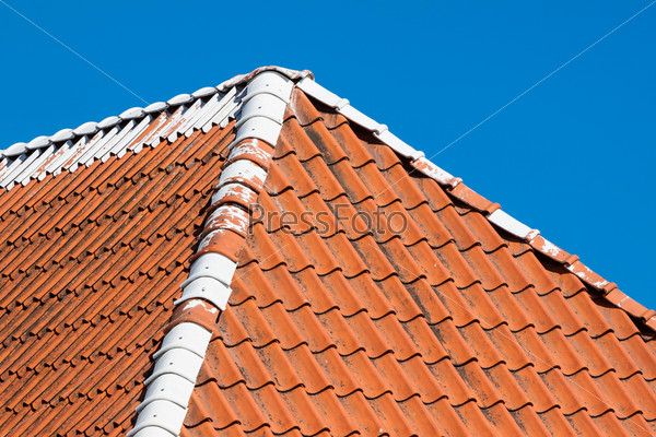 Red roof tiles background details with sky