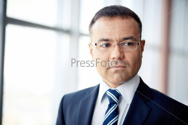 Portrait of confident businessman in eyeglasses