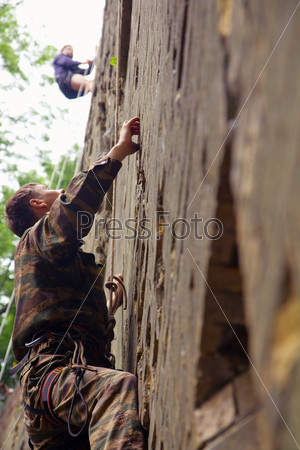 Rock climber climbing up