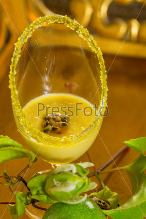 Glass of passion fruit mousse,  with fresh green passion fruit