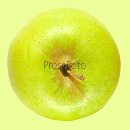Зеленое яблоко Гренни Смит, изолированное на зеленом фоне
