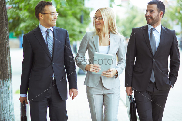 Image of friendly business team with two confident men and a lovely lady