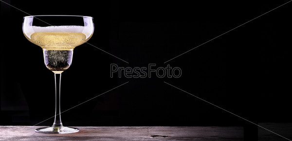 glass of champagne isolated on black background