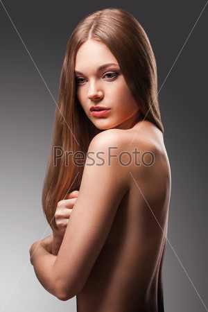 beautiful woman in the fog with naked back portrait over gradient background