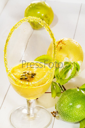 Passion fruit mousse,  with fresh green and yellow passion fruit, on white tray