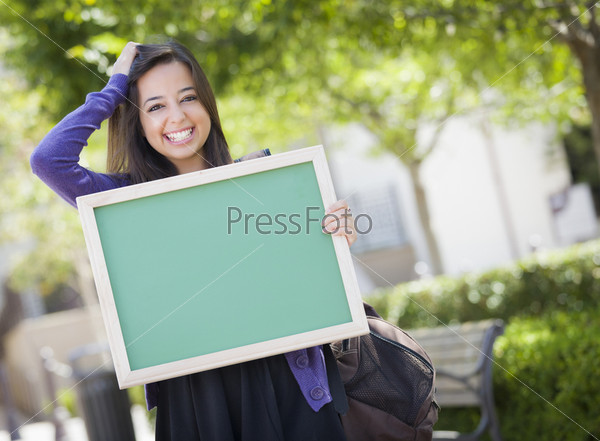 Portrait of An Attractive Excited Mixed Race Female Student Holding Blank Chalkboard and Carrying Backpack on School Campus.