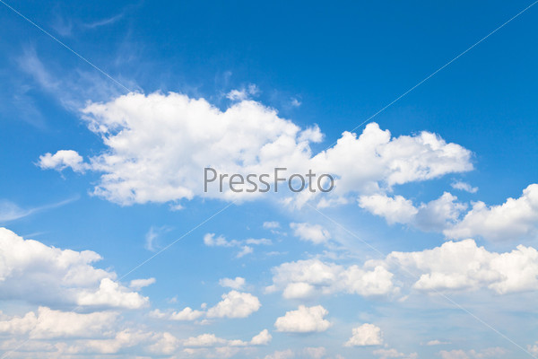 many cumulus white clouds in blue sky in summer day