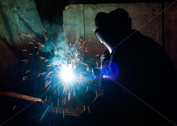 Tyumen, Russia - August 13, 2013:Welding department at Concrete Goods Plant No. 5. skilled working factory welder